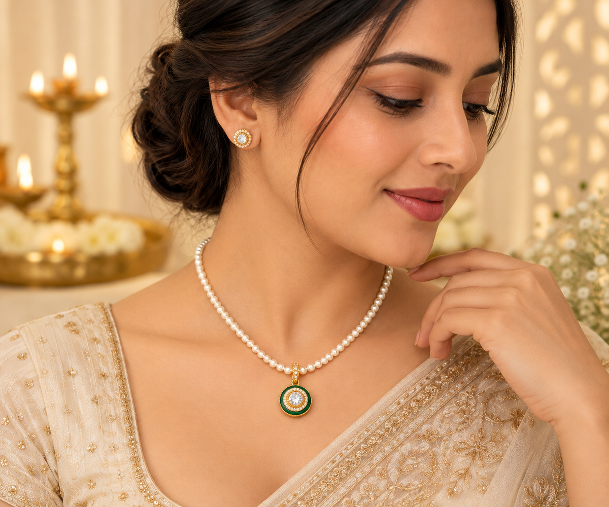 Woman wearing the Kundan pendant necklace and matching stud earrings in a festive setting
